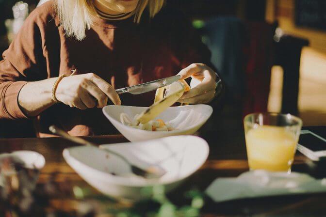 mid-section-woman-preparing-food