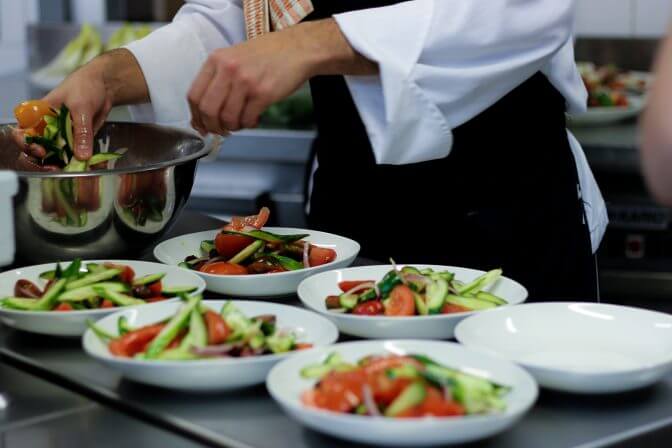 midsection-chef-preparing-food-kitchen